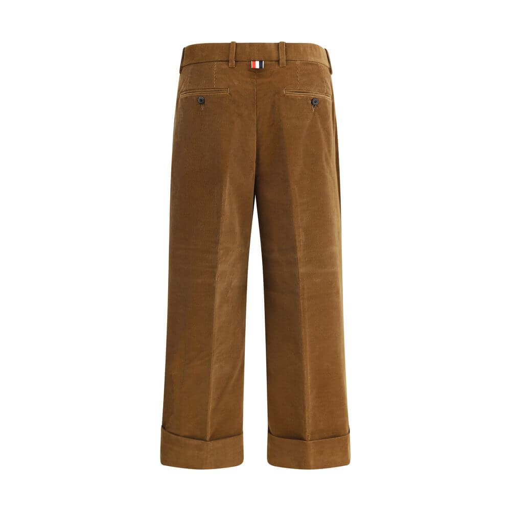 Thom Browne Brown Cotton Casual Pants with tricolor applique, straight leg, turned-up hems, and front zipper closure.
