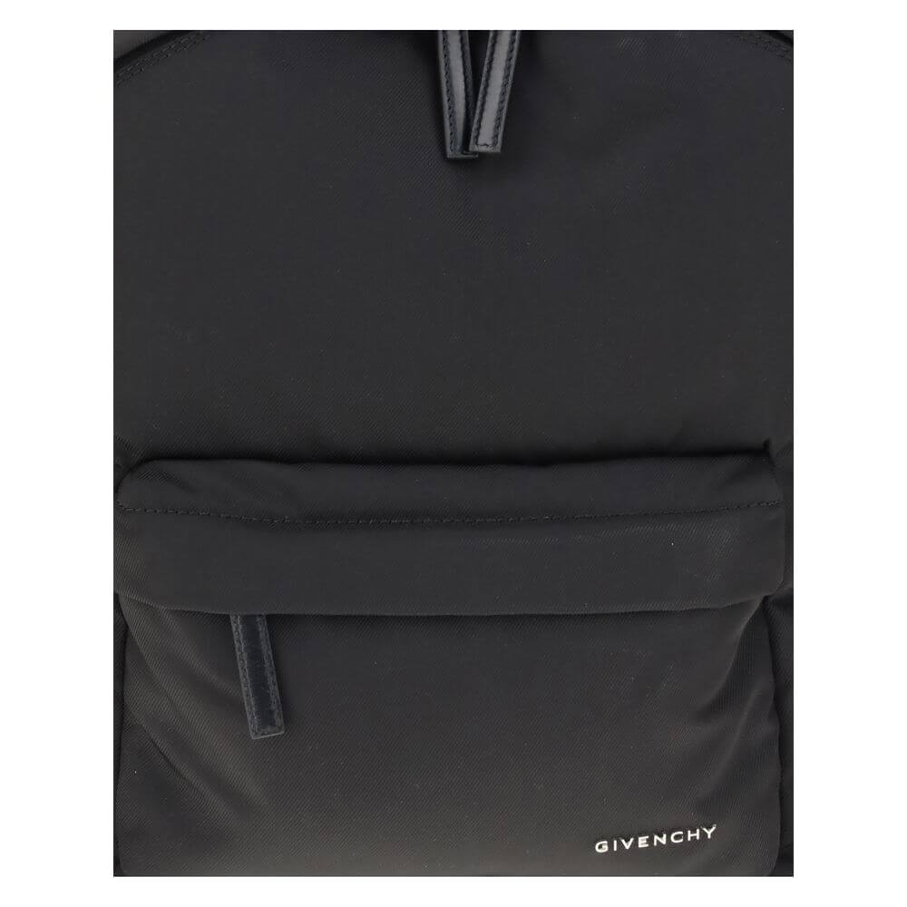 Givenchy Black Polyamide Backpack with front zip pocket and metal signature logo on the front for a modern, stylish look.