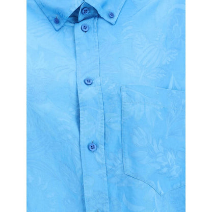 Close-up of Balenciaga Blue Viscose Pattern Shirt featuring floral design, button-down front, and chest pocket for a contemporary look.