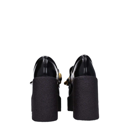 Back view of Stella McCartney Black Leather Platform Loafers with high heel and rubber sole.