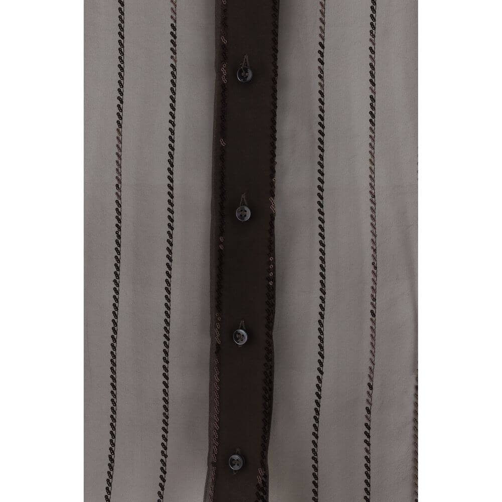 Close-up of Brunello Cucinelli Brown Silk Blouse with sequins and button closure, showcasing elegance and sophistication, AW25 collection.