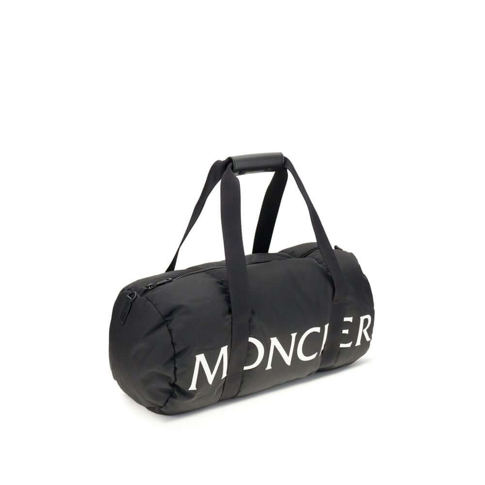 Moncler Black Nylon Luggage And Travel duffle bag with logo, leather-tab handles, adjustable shoulder strap, and zip closure.
