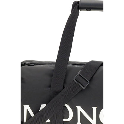 Close-up of Moncler Black Nylon Luggage And Travel bag with adjustable strap and logo.
