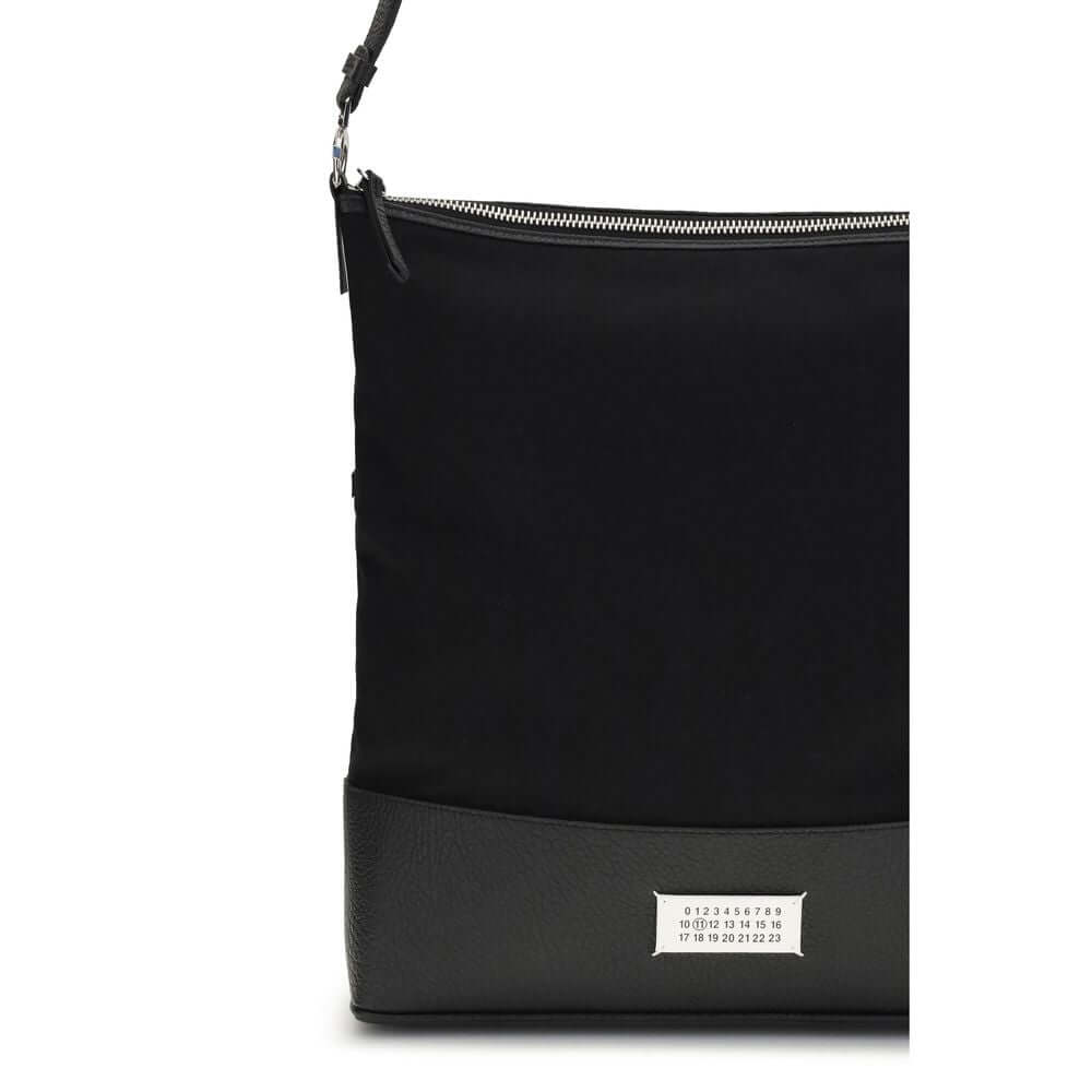 Margiela Black Cotton Shoulder Bag with leather strap and Numeric Signature label on front, elegant design by Maison Margiela.