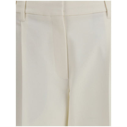 Close-up of Brunello Cucinelli White Cotton Chino Pants showcasing front pleats and elegant design.
