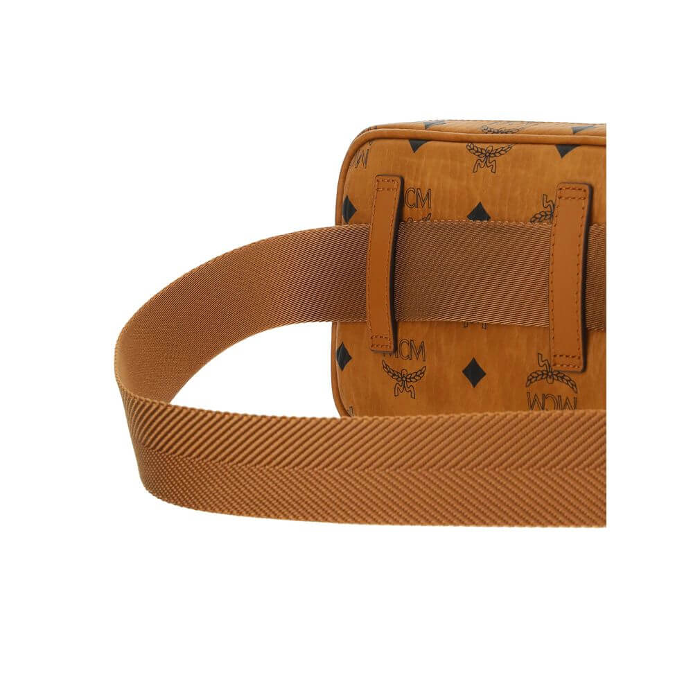 MCM Brown Cotton Shoulder Bag with adjustable strap and iconic monogram print, featuring gold-tone details for added sophistication.