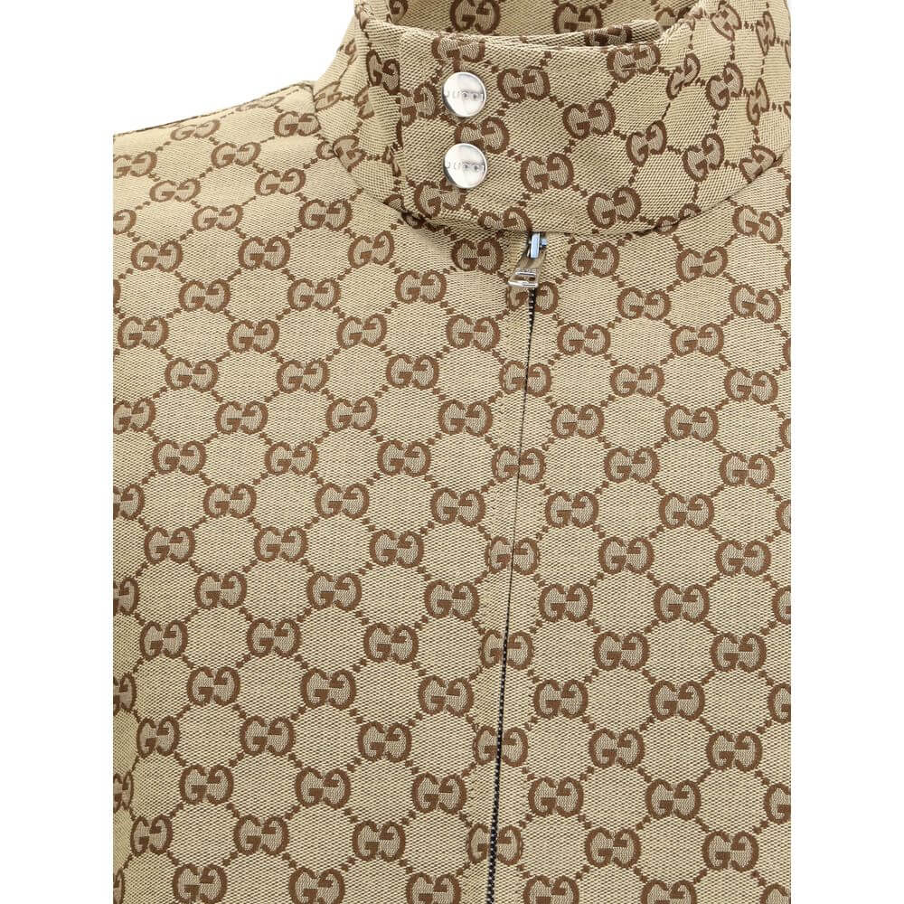 Close-up of Gucci Beige Cotton Shell Jacket with GG Supreme pattern and snap button collar.