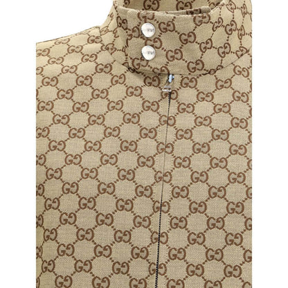 Close-up of Gucci Beige Cotton Shell Jacket with GG Supreme pattern and snap button collar.