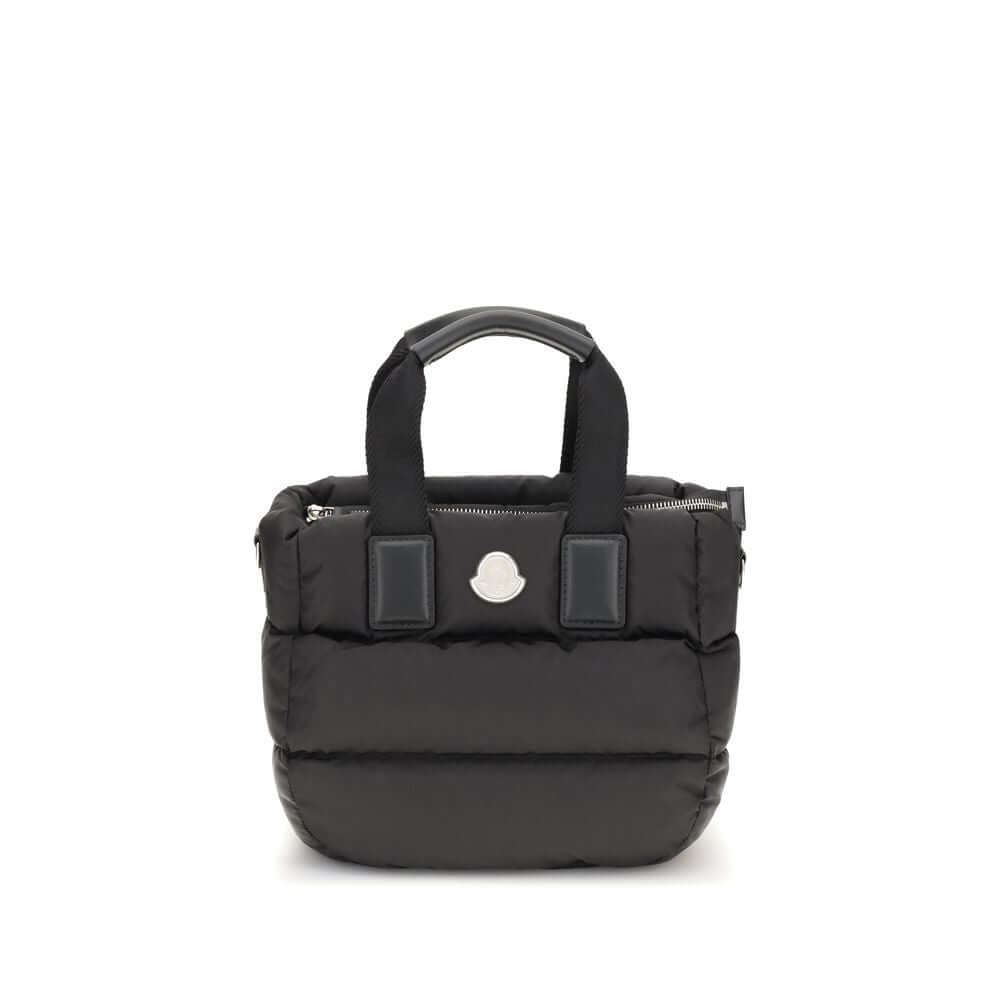 Moncler Black Polyamide Handbag with down padding, ribbon handles, and detachable strap.