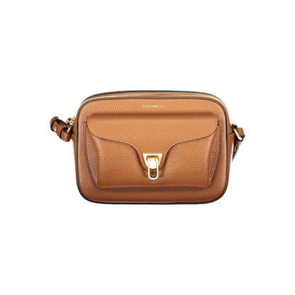 Coccinelle Brown Leather Women Handbag with adjustable strap and twist closure, epitome of Italian sophistication and functionality.