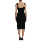 Back view of a Dolce & Gabbana Black Wool Sleeveless Rose Applique Dress, showcasing its elegant design and sophisticated fit.
