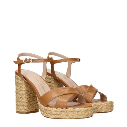 Stuart Weitzman Brown Leather Platform Sandals with woven wedge design and ankle strap.