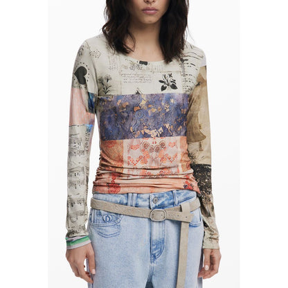 Woman wearing Desigual Beige Viscose Women Top with artistic patterns and wide neckline, paired with casual jeans.