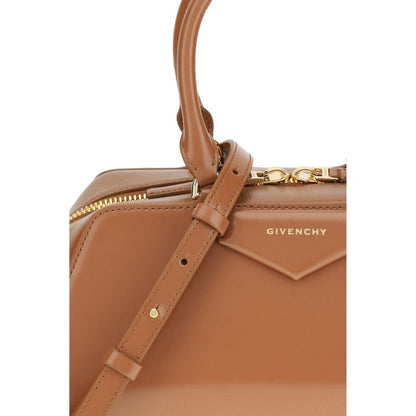 Close-up of Givenchy Brown Calf Leather Bos Taurus Handbag with embossed logo and leather strap detail.