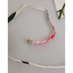 Close-up of Dolce & Gabbana White Floral Swimsuit 2 Piece Top Bottom Swimwear strap with metal detail.