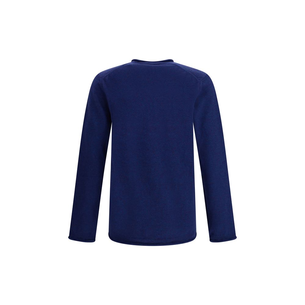 Back view of Comme Des Garçons Blue Wool Sweatshirt showcasing long sleeves and ribbed texture, designed for autumn-winter elegance.