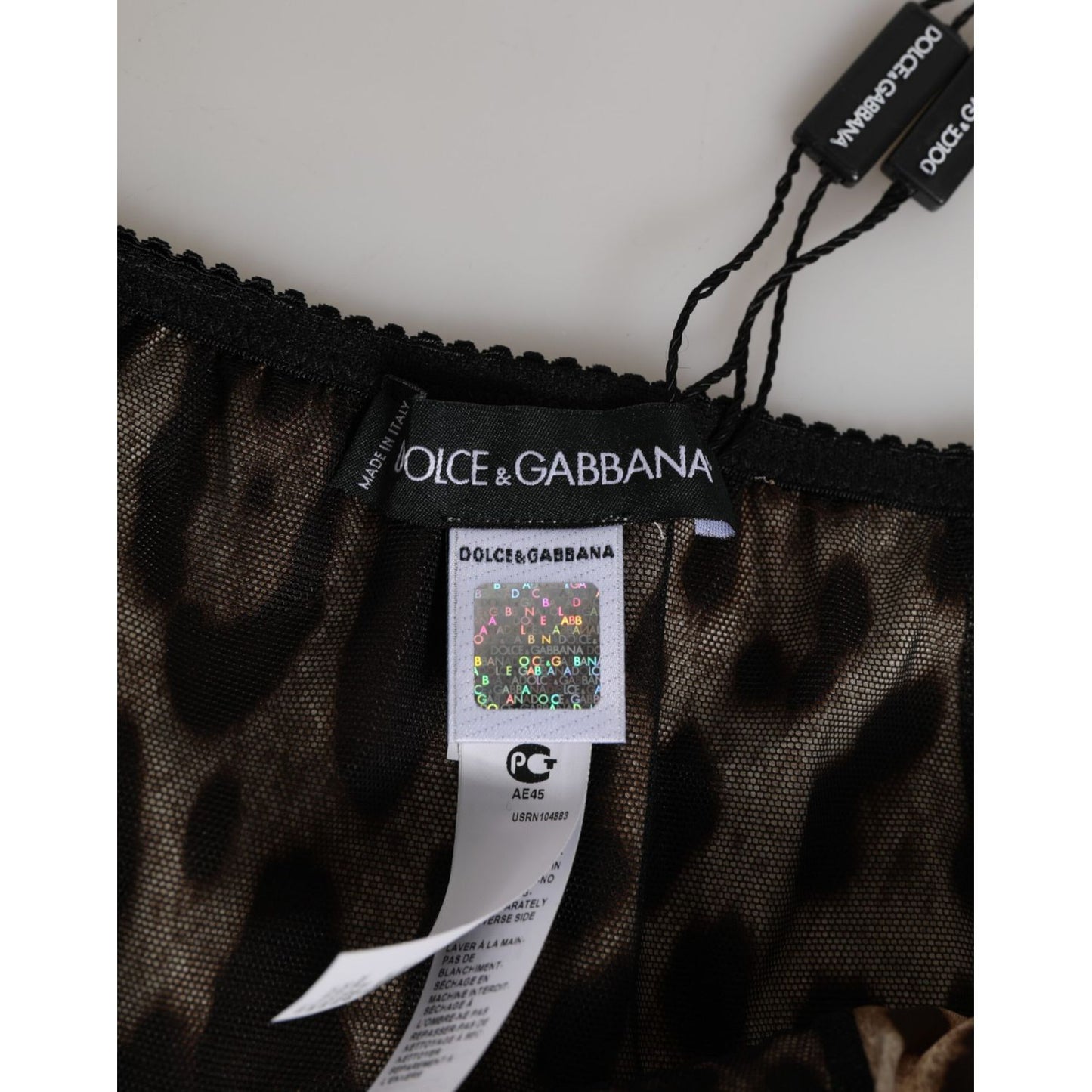 Close-up of Dolce & Gabbana Brown Leopard Silk Mid Waist Panty Underwear label and tag details.