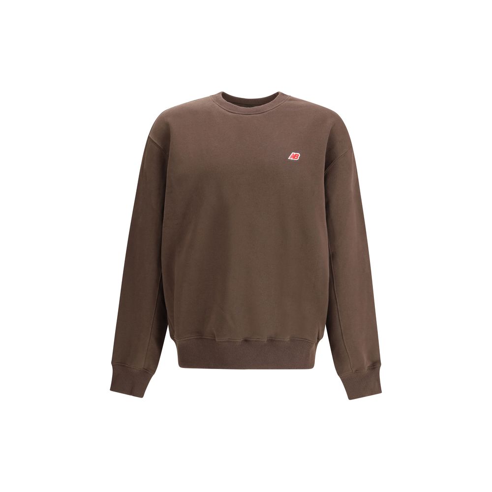 New Balance Brown Cotton Sweatshirt with crew neckline, relaxed fit, and ribbed cuffs, ideal for casual wear in AW25 season.