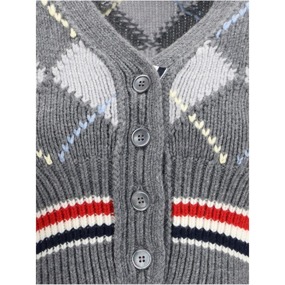 Close-up of Thom Browne Gray Fleece Wool Cardigan showcasing argyle pattern and button detail.