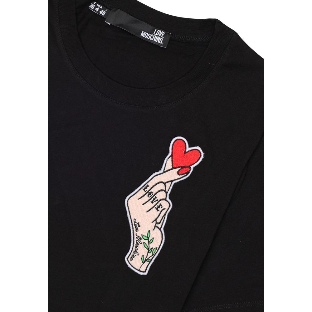 Love Moschino Black Cotton T-Shirt with heart hand print on chest, 100% cotton, iconic style, women's short-sleeve, soft fit.