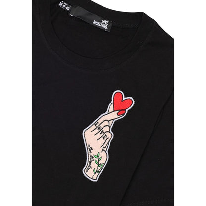 Love Moschino Black Cotton T-Shirt with heart hand print on chest, 100% cotton, iconic style, women's short-sleeve, soft fit.