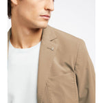 Person wearing AT.P.CO Beige Polyamide Blazer with classic collar and chest pocket detail