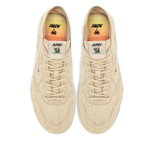 Top view of AUTRY Sneakers Ivory with canvas upper, lace-up design, and beige jute sole, featuring logo patch and tonal stitching.