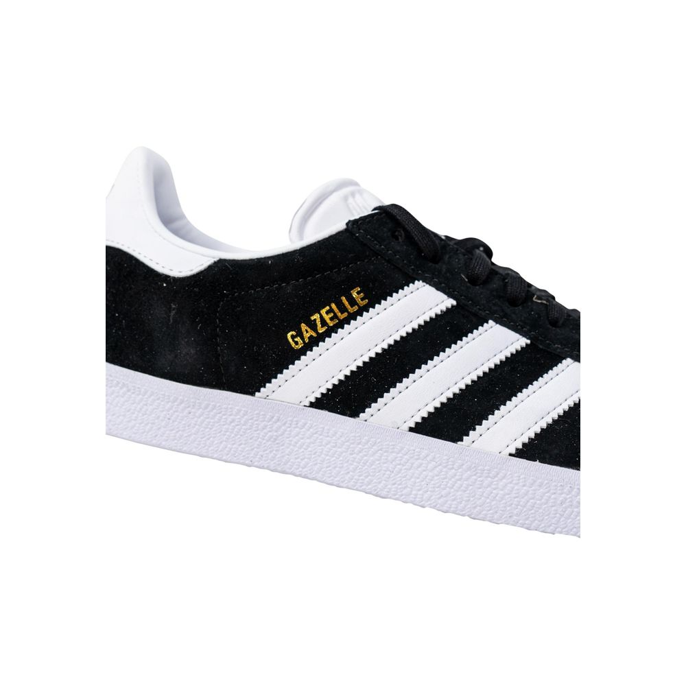 Adidas Black Polyethylene Sneaker with iconic Gazelle design and three white stripes, featuring durable rubber sole and elegant logo.