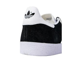 Close-up of Adidas Black Polyethylene Sneaker showing logo and textured rubber sole for excellent grip.