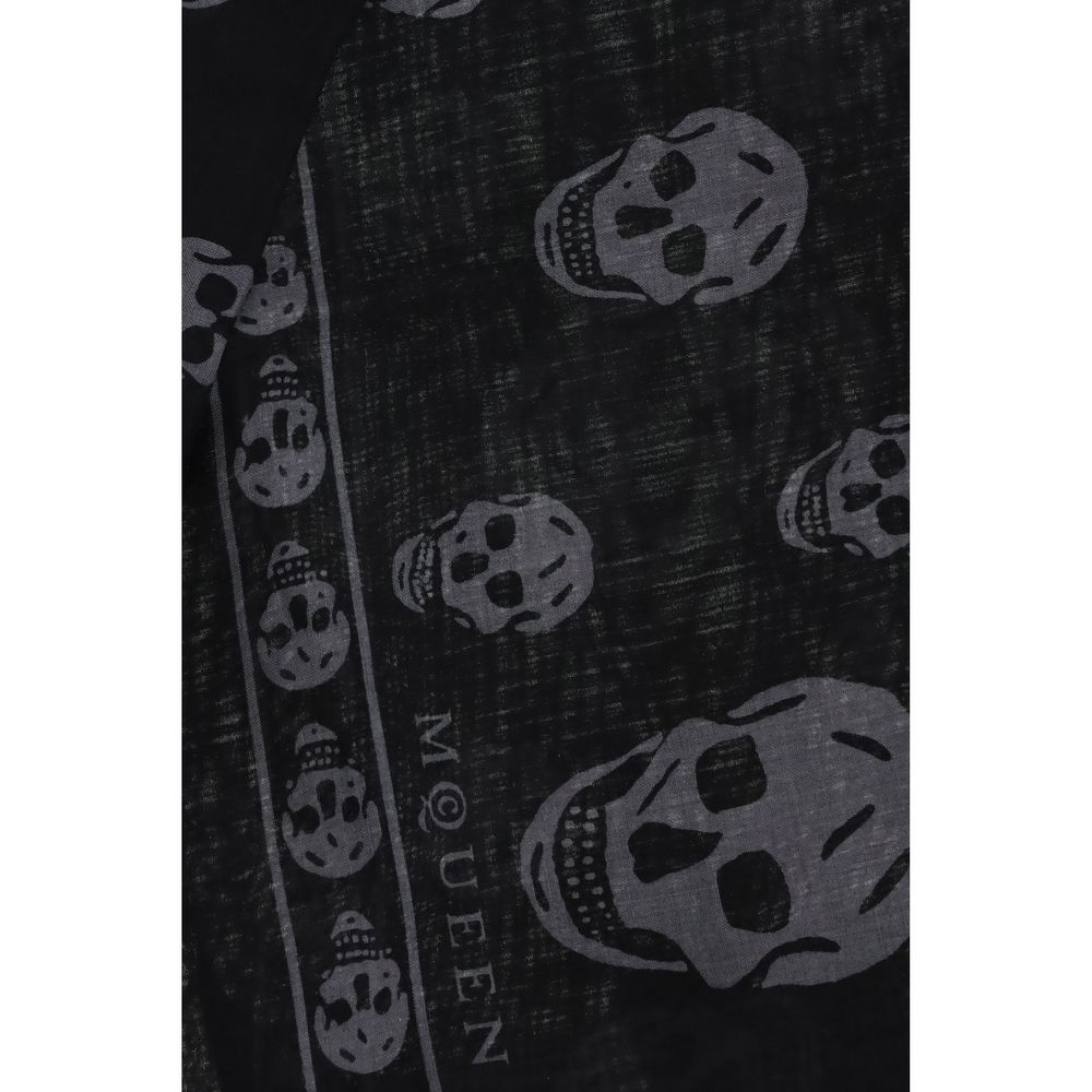 Close-up of Alexander McQueen Black Modal Scarf with skull motif, fringed edges, and logo. Made from silk and modal blend, size 120x120.