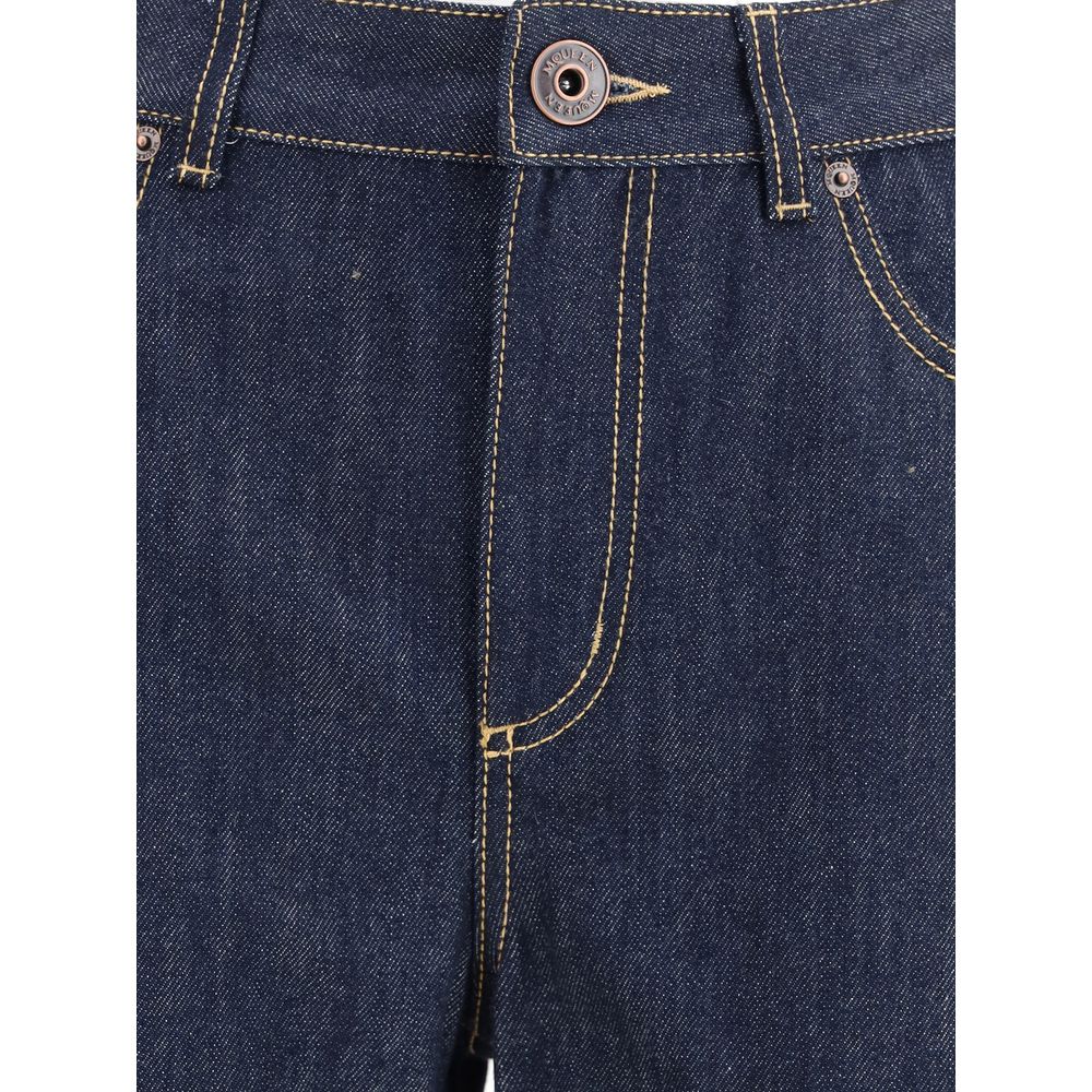 Close-up of Alexander McQueen Blue Cotton Straight-Leg Jeans showing dark denim with contrast stitching and button closure.