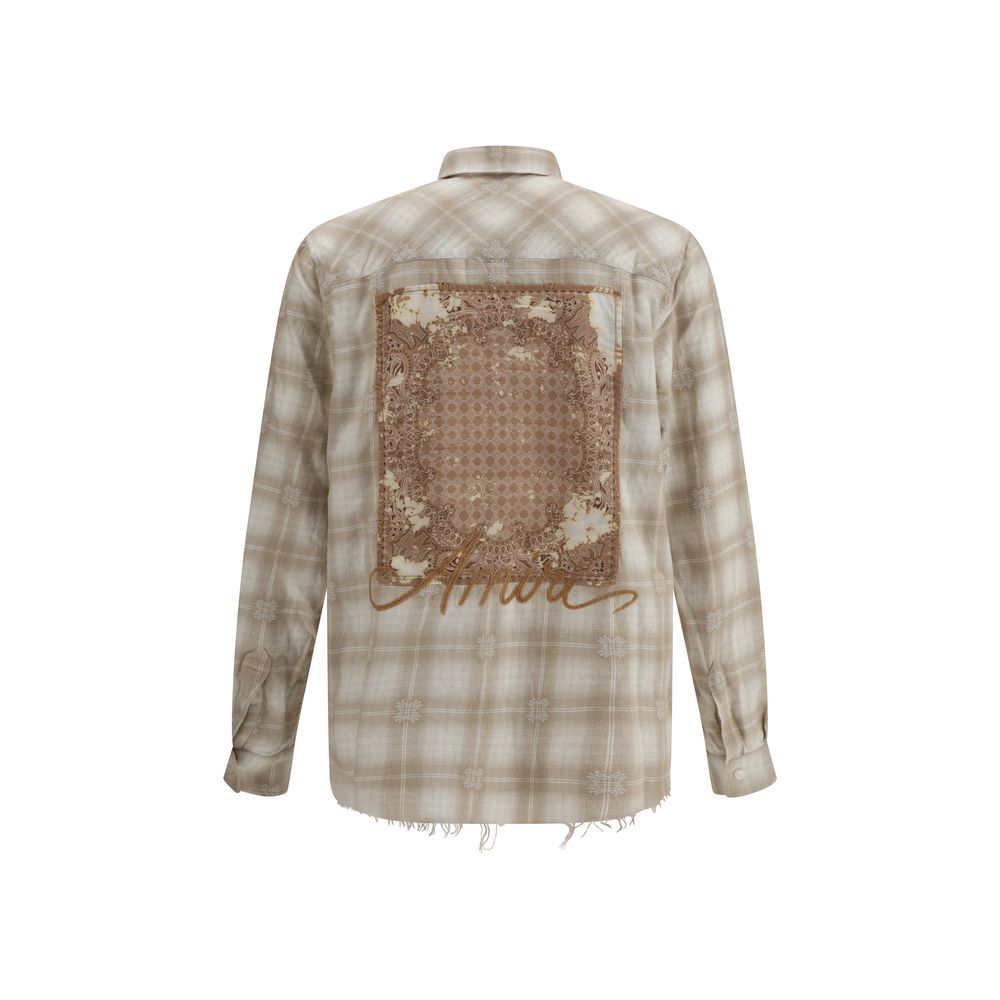 Back view of Amiri Beige Cotton Pattern Shirt showcasing plaid flannel, embroidered logo, and raw-cut hem.