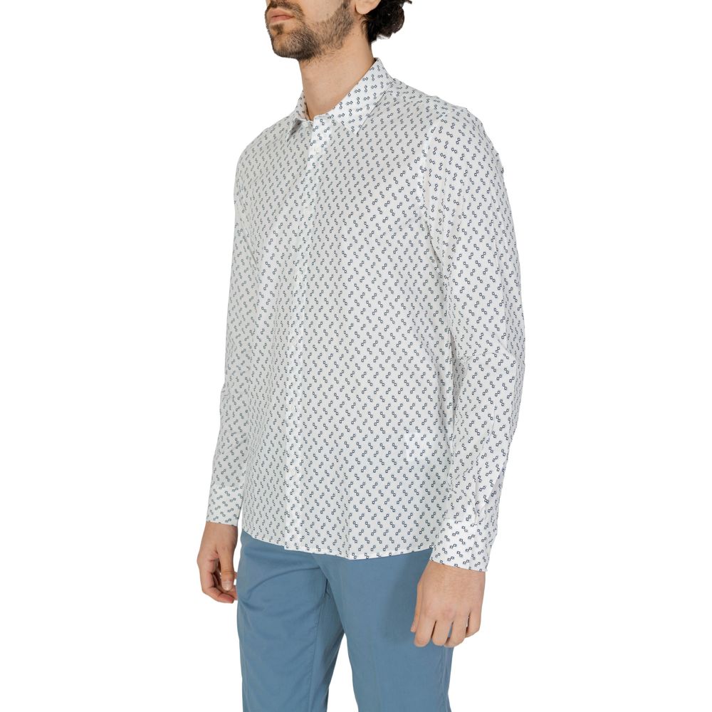 Man wearing Antony Morato White Viscose Shirt with geometric print and blue pants for a sophisticated look.