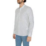Man wearing Antony Morato White Viscose Shirt with geometric print and blue pants for a sophisticated look.