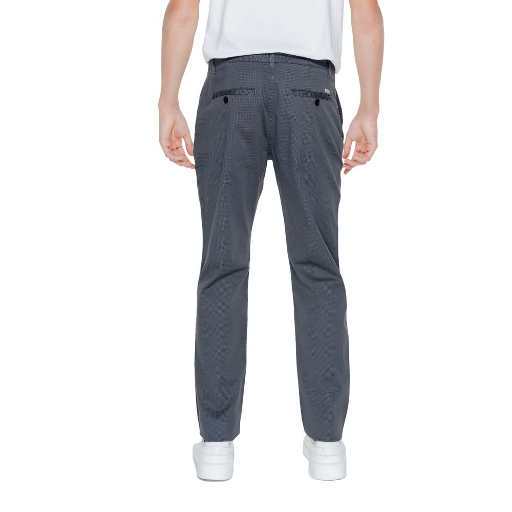 Back view of Armani Exchange Black Cotton Casual Pants on model showcasing design and fit.
