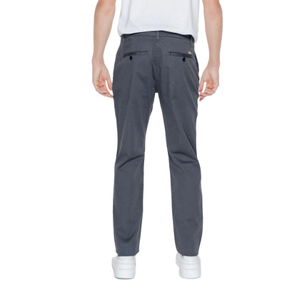 Back view of Armani Exchange Black Cotton Casual Pants on model showcasing design and fit.