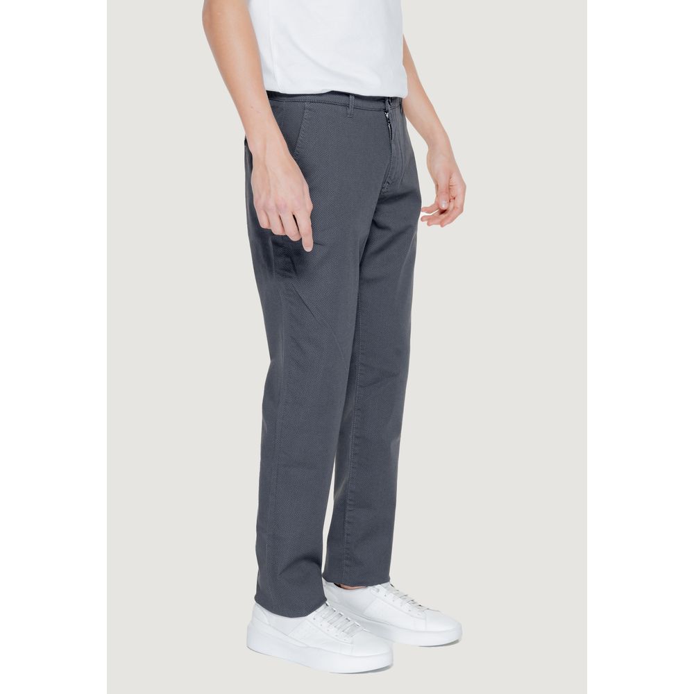 Model wearing Armani Exchange Black Cotton Casual Pants with white shoes, showcasing regular fit and modern style.