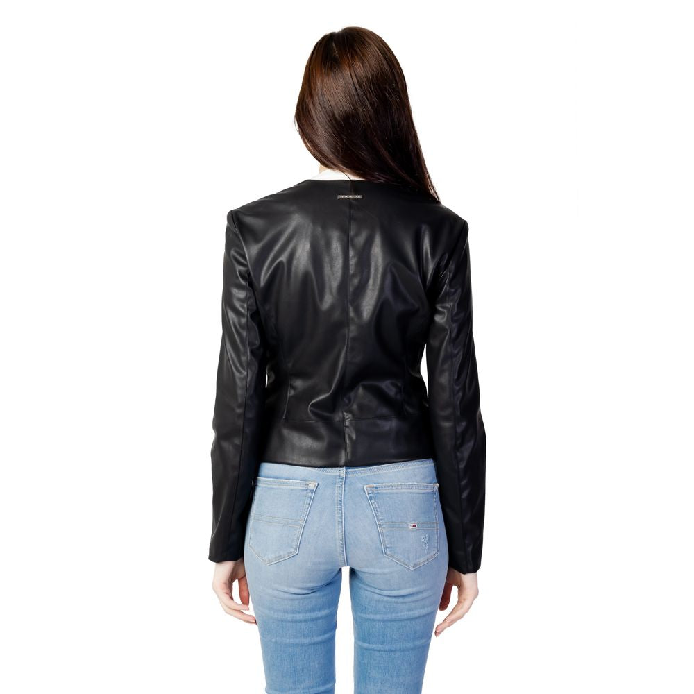 Back view of Armani Exchange Black Leather Jacket on woman with long hair, showcasing fitted design and leather-effect texture.