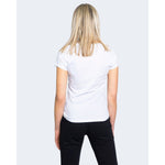 Woman wearing an Armani Exchange White Cotton T-Shirt, short-sleeved, 100% cotton, perfect for casual wear.