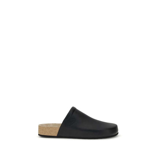 Balenciaga Black Calf Leather Bos Taurus Mules with cork insole, offering modern style and natural comfort.