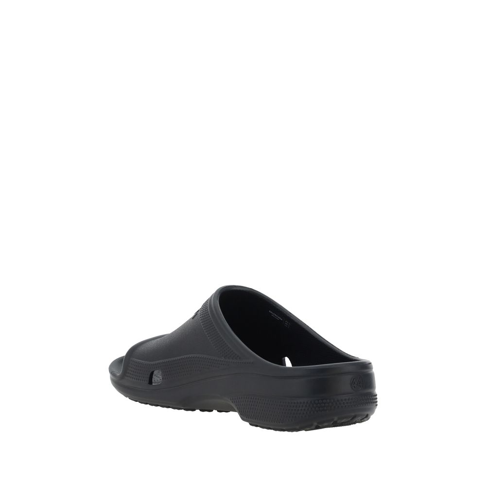 Back view of Balenciaga Eva Sandals showcasing unique rubber design and embossed logo on front strap, SS25 Collection.