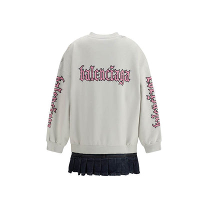 Back view of Balenciaga Multicolor Cotton Sweatshirt with printed logo and denim pleated skirt, showcasing urban grunge style.