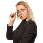 Person wearing Bally Brown Unisex Glasses Frame, showcasing half-rim round style in brown plastic. Size 47-20-145.