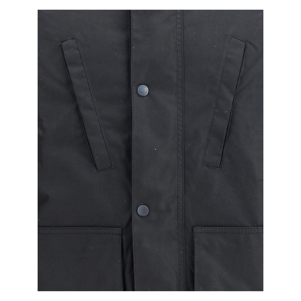 Close-up of Barbour International Black Cotton Parka showing front buttons and pocket details.