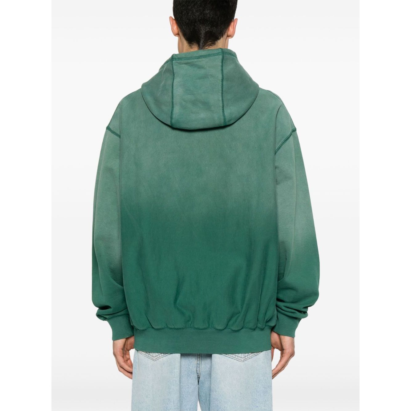 Back view of model wearing Billionaire Sweaters Green oversized hoodie with ribbed cuffs and hem.