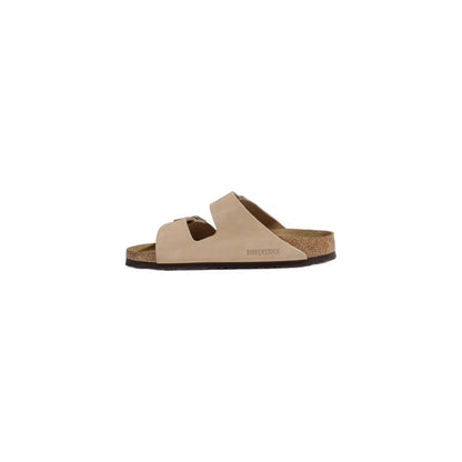 Birkenstock Beige Nubuc Leather Slippers with adjustable straps and cork footbed, side view.