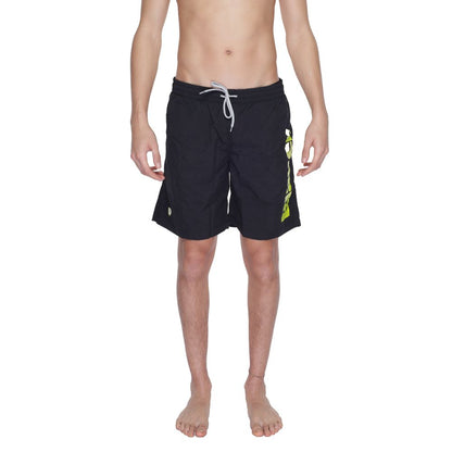 Blauer Black Polyamide Swim Shorts featuring an elastic waistband and bold logo, perfect for beach or pool, model wearing the product.