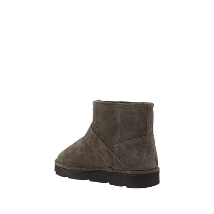 Brunello Cucinelli Brown Calf Leather Bos Taurus Ankle Boots with knurled sole and adjustable buckle, rear view.
