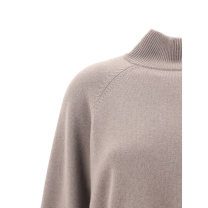 Close-up of Brunello Cucinelli Brown Cashmere Turtleneck's ribbed collar and raglan sleeves, showcasing luxury and contemporary style.