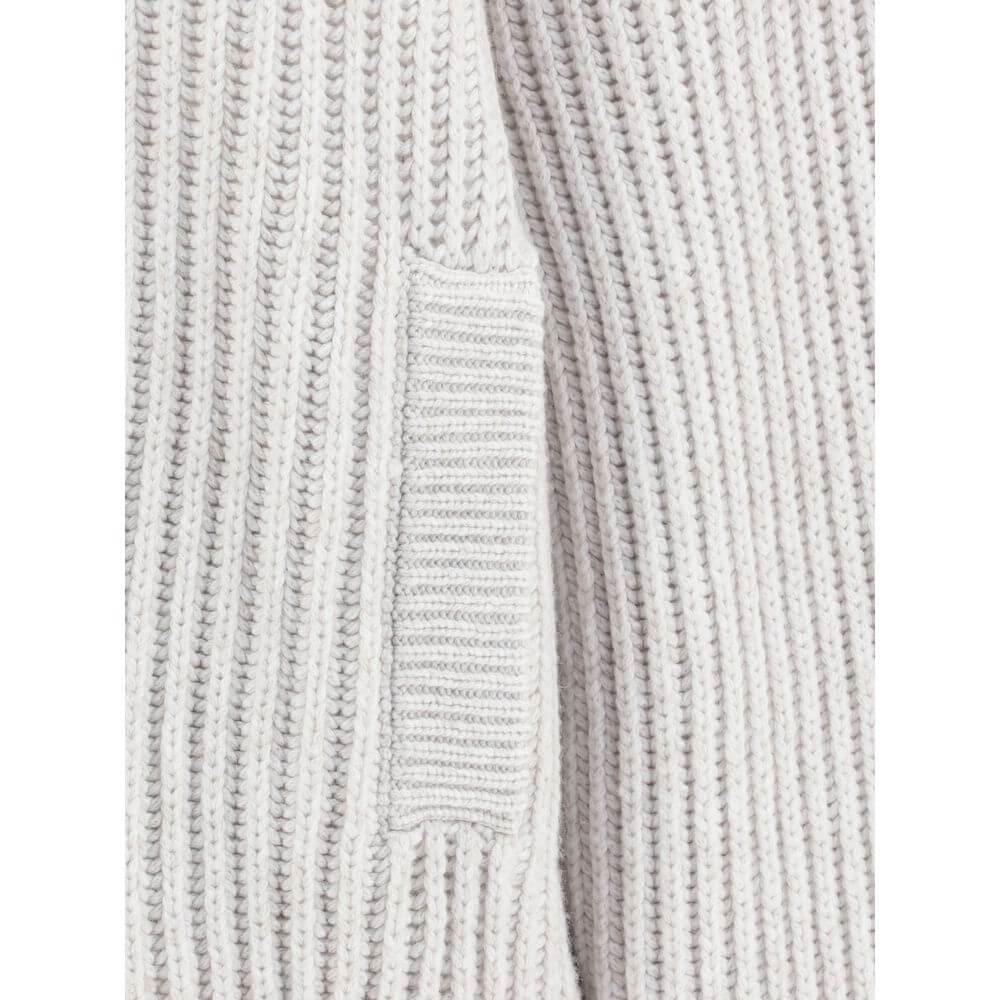 Close-up of Brunello Cucinelli White Cashmere Cardigan showcasing ribbed texture and welt pocket detail.
